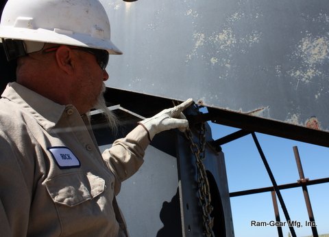 Technician pointing out a structural detail during inspection